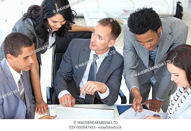 Businessteam working together in a business plan in office