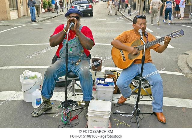 Two musicians perform in street of French Quarter