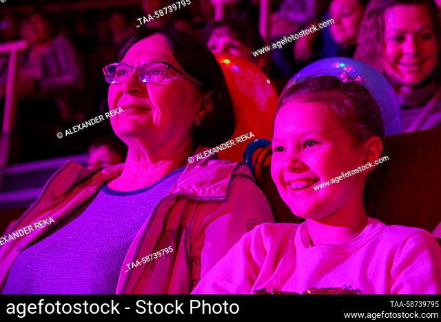 RUSSIA, LUGANSK - APRIL 29, 2023: Spectators smile as they watch the Girl and Elephant Show at Lugansk State Circus. Directed by animal tamer Andrei...