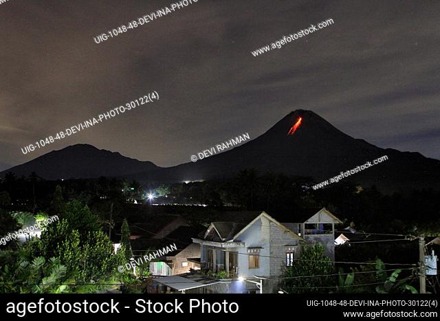 Lava flows down from the crater of Mount Merapi, Indonesia's most active volcano, as seen from South Kaliurang village in Magelang, Central Java on January 3