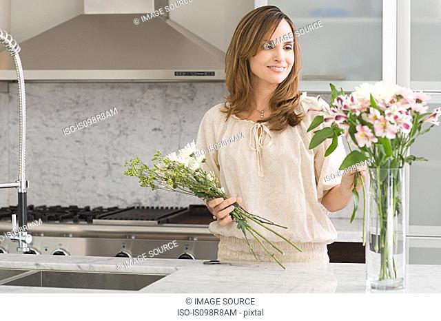 Hispanic woman flower arranging