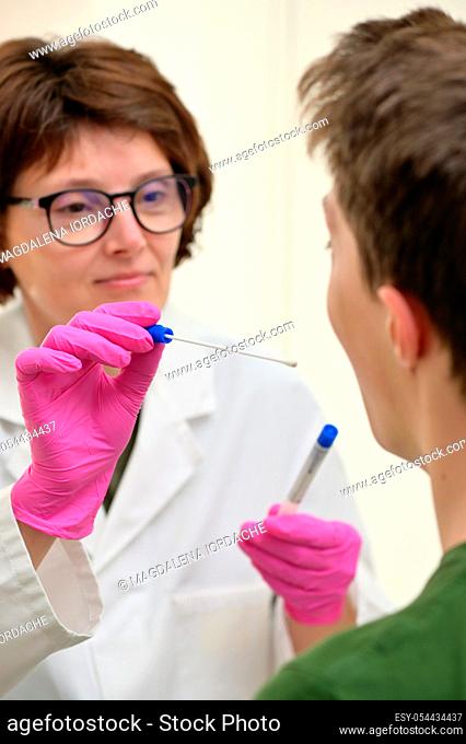 Doctor Collecting with a nasopharyngeal nose and throat swab