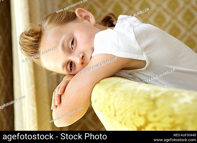 Portrait of a girl lying on a couch