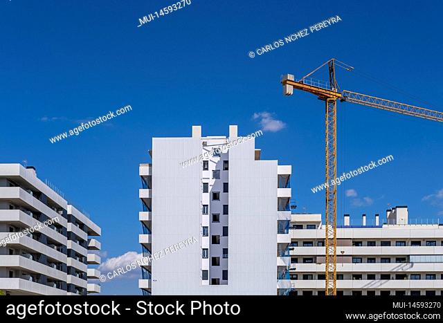 Construction cranes in apartment buildings in Barcelona