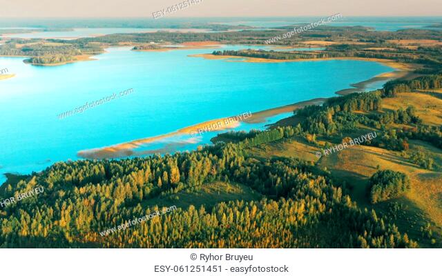 4K Aerial View Of Lake And Green Forest Landscape In Sunny Summer Morning. Top View Of Beautiful European Nature From High Attitude. Bird's Eye View