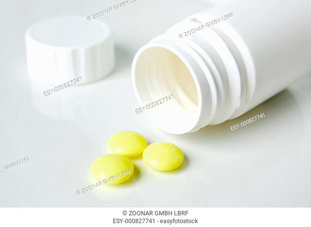 Bottle with yellow pills