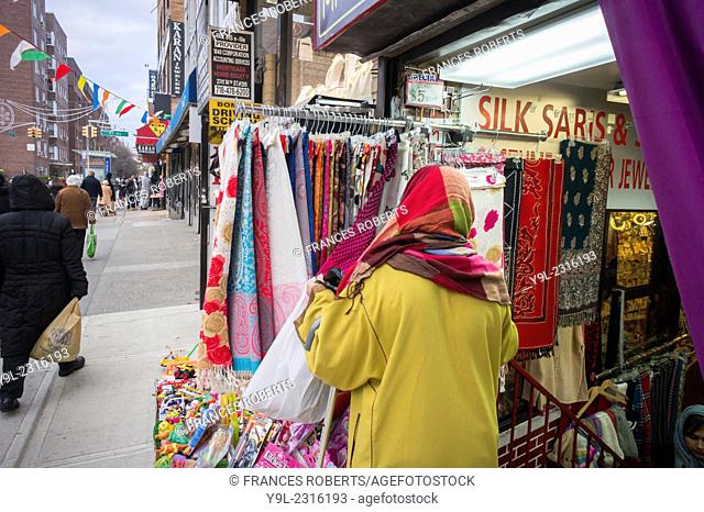 A woman shops scarves in the Jackson Heights neighborhood of Queens in New York.. Besides a growing Tibetan community, Jackson Heights is a polyglot of...