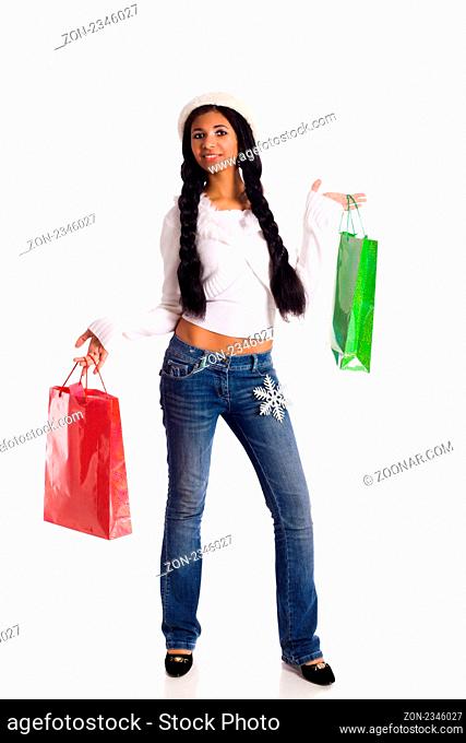Young Woman shopping holding bags wearing warm clothes isolated