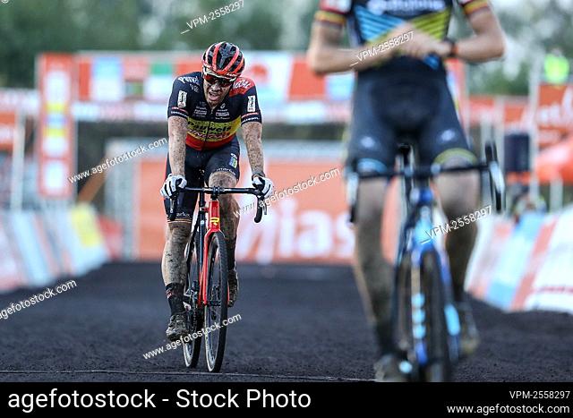 Belgian Laurens Sweeck crosses the finish line second place at the men's elite race at the 'Poldercross' cyclocross cycling race in Bazel, Kruibeke