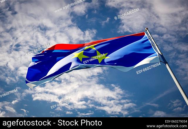 Beautiful national state flag of Vojvodina fluttering at sky background. Low angle close-up Vojvodina flag 3D artwork