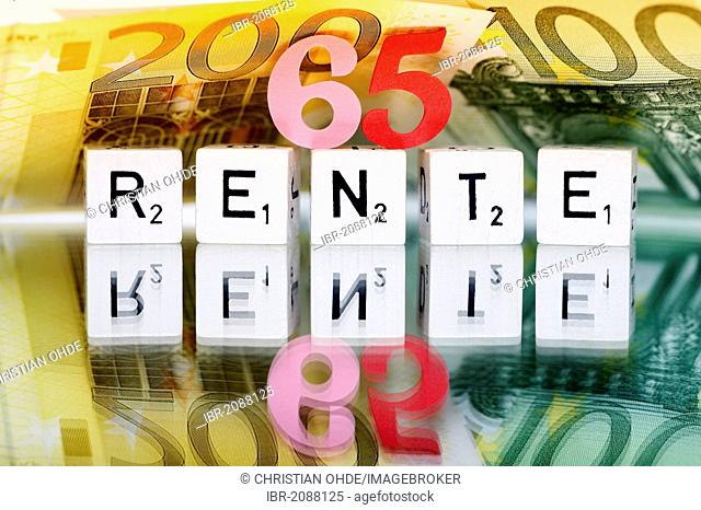 Cubes with letters forming the word Rente, German for pension, symbolic image for retirement starting at 65 years