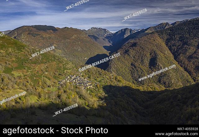 Aerial views of Bausen and Canejan villages and the surrounding forests in autumn (Aran Valley, Catalonia, Spain, Pyrenees)
