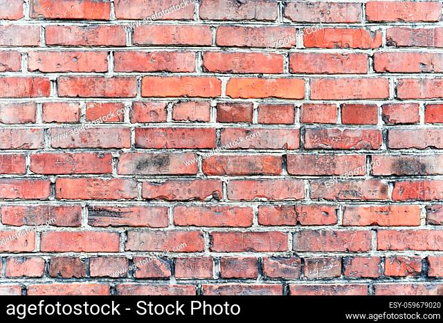 Fragment of an old brick wall of an apartment house - Background