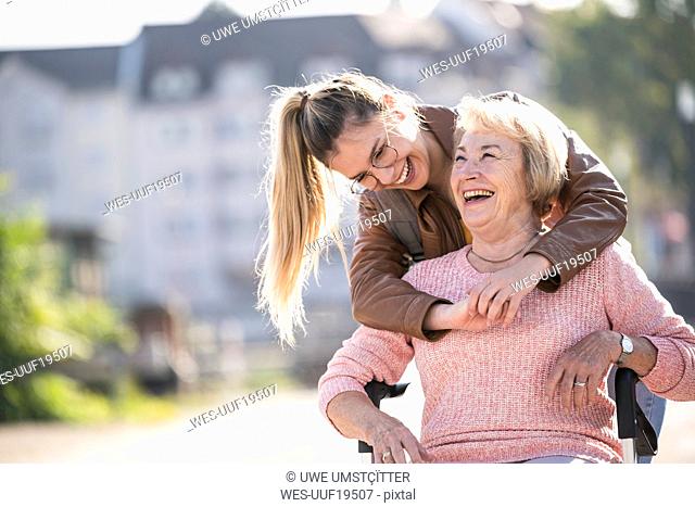 Granddaughter and her grandmother laughing