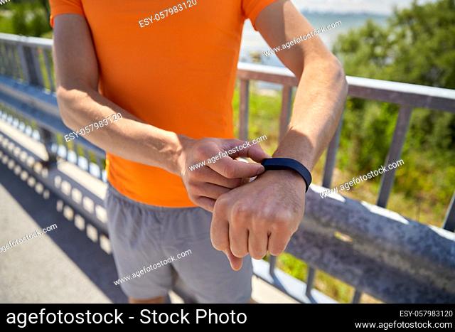 close up of man with fitness tracker outdoors