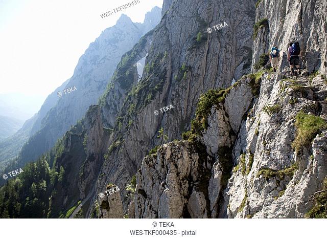 Austria, Tyrol, Wilder Kaiser, two men on via ferrata towards Goinger Halt