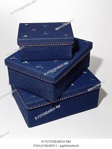 Close-up of set of 3 denim storage boxes decorated with floral motif