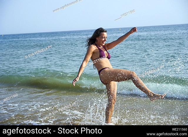 Woman enjoying healthy activities on the beach