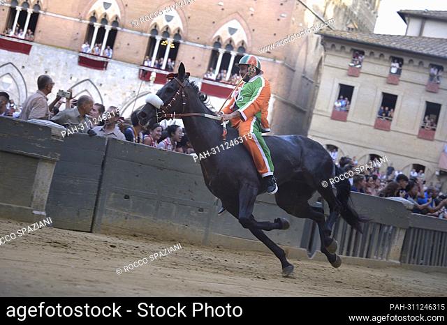 Jockeys compete at the historical horse race Palio di Siena 2022 on August 17, 2022 in Siena, Italy. - rome/Rome/