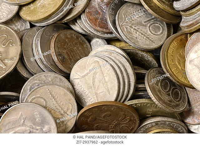 heap of old coins on sale in bric-a-brac antiques street market, shot at Mediterranean little town of Chiavari, Genova, Liguria, Italy