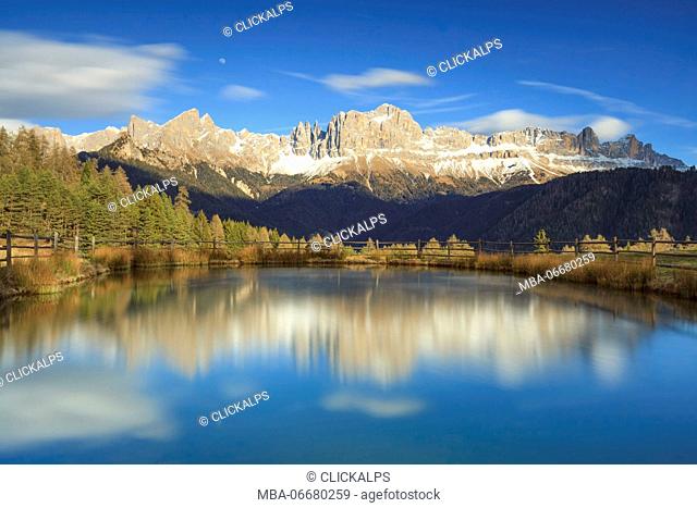 Europe, Italy, Valley of Tiersertal, South Tyrol, Alto Adige, Dolomites. Reflections of Catinaccio - Rosengarten at sunset on the lake Wuhn