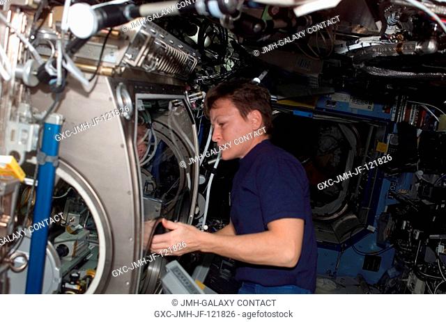 Astronaut Peggy A. Whitson, Expedition 16 commander, works at the Microgravity Science Glovebox (MSG) in the Destiny laboratory of the International Space...
