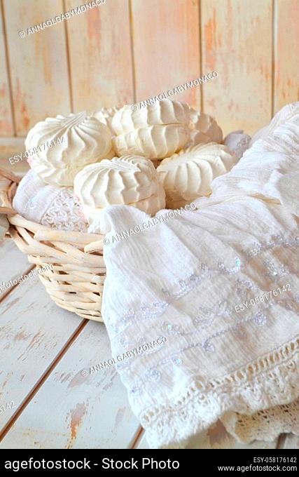 Russian dessert zefir. Tender marshmallows on shabby wooden background. Rustic Valentines zefir on white lace and wooden table