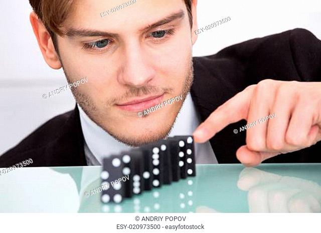 Businessman Playing Domino
