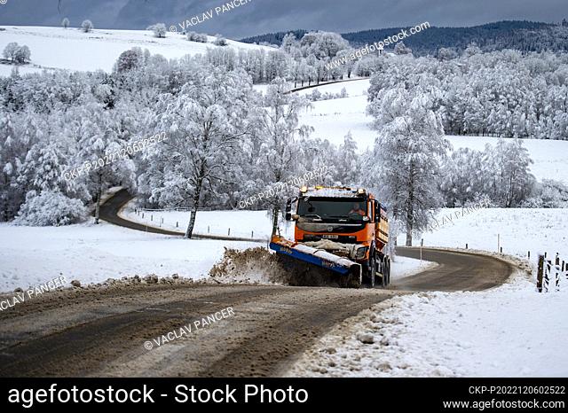 A gritter shovels loose snow from the road between Zelnava and Bela in the Sumava region of Prachatice, 6 December 2022.  (CTK Photo/Vaclav Pancer)
