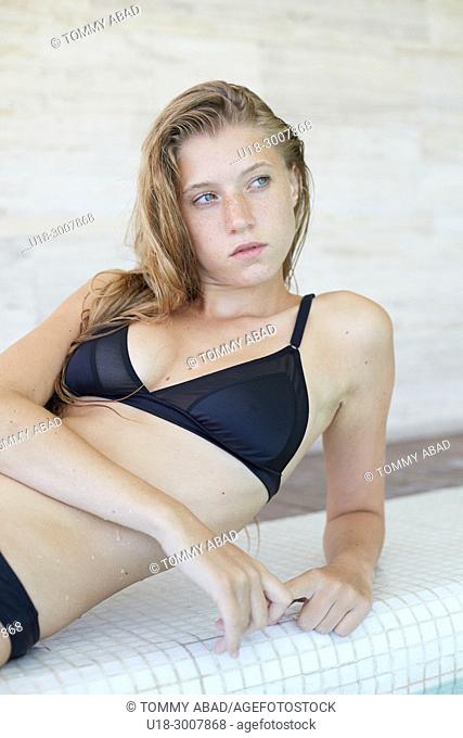 Blonde girl in black bikini