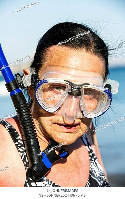 Portrait of senior woman wearing scuba mask