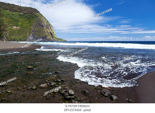 Water coming on shore with the tide; Big Island, Hawaii, United States of America
