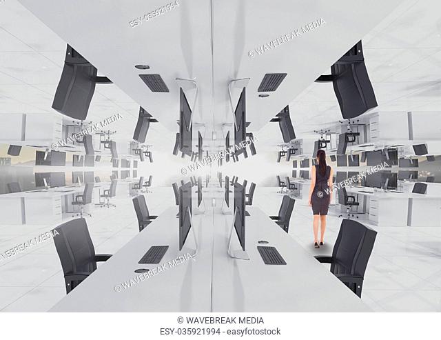 businesswoman standing in inverted office with flare