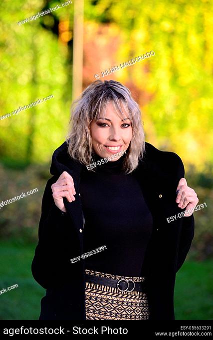 Young woman in a park wearing casual clothes