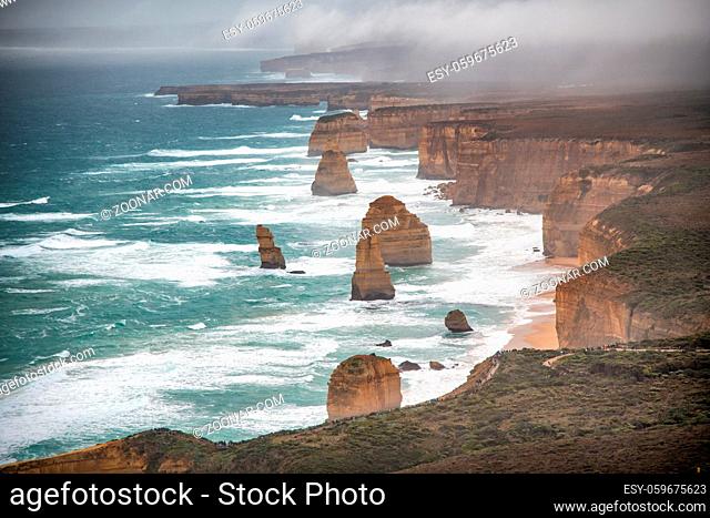 Helicopter aerial view of Twelve Apostles along Great Ocean Road during a storm - Port Campbell, Australia