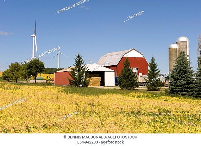 Agricultural Wind Farm farms turbine produces kinetic energy in wind into mechanical energy converting wind to electricity in Michigan near Ubly Michigan
