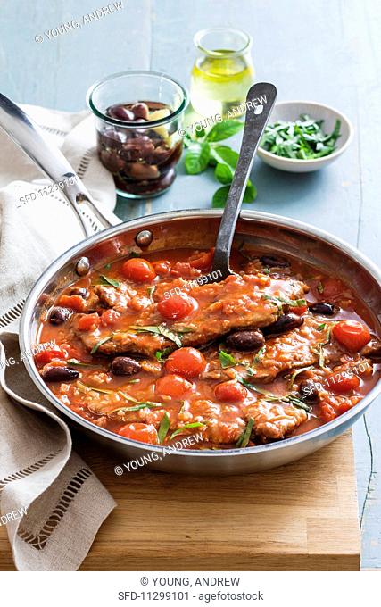 Vitello alla caprese (veal escalope in tomato sauce with olives)