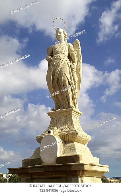 Statue of Archangel Saint Raphael on the Roman bridge of Cordoba, Andalusia, Spain