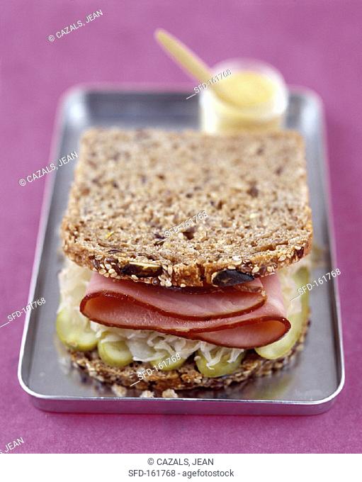 Wholemeal sandwich with pickled gherkins, sauerkraut & ham