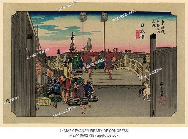 Nihonbashi. Print shows porters carrying bundles across the Nihon Bridge on the Tokaido Road. Date between 1830 and 1858, printed later