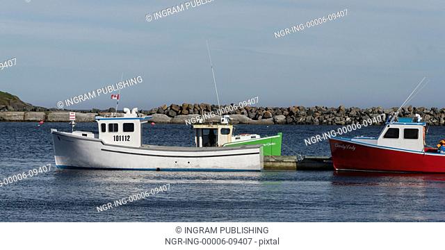 Fishing boats moored at dock, Main-a-Dieu, Cape Breton Island, Nova Scotia, Canada