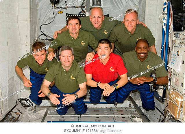 The STS-122 crewmembers pose for an in-flight crew portrait following a joint news conference with the Expedition 16 crewmembers from the Columbus laboratory of...