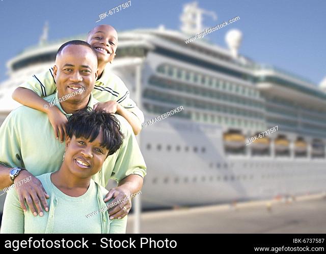 Happy african american family in front of cruise ship