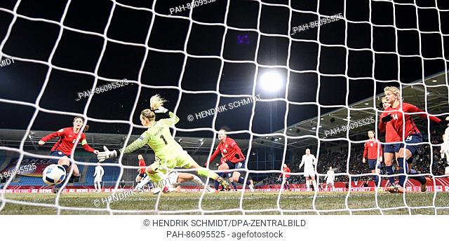 Norway's goalkeeper Ingrid Hjelmseth (2-L) blocks a shot on goal in the women's internation soccer match between Germany and Norway in the community4you Arena...