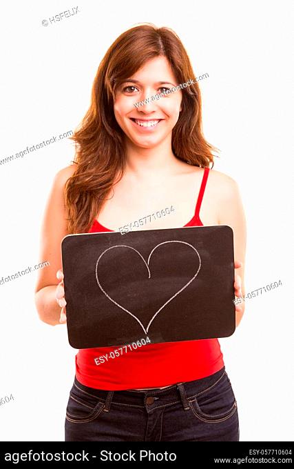 Beautiful woman presenting a black board with a heart on it
