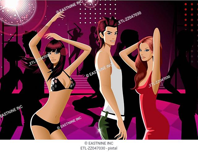 Portrait of a man with two women dancing in a nightclub