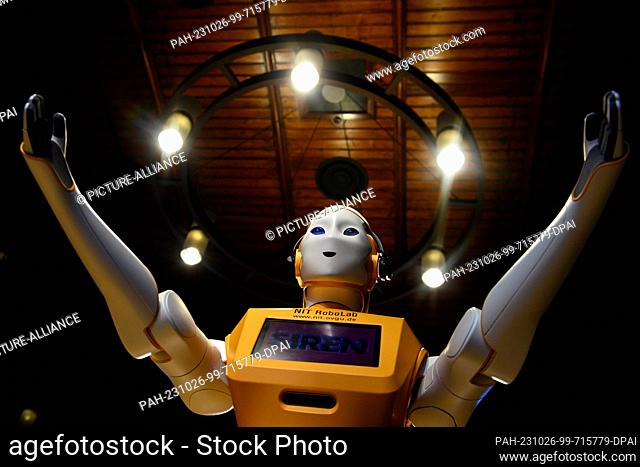 26 October 2023, Saxony-Anhalt, Magdeburg: The humanoid robot ""Ari"" spreads its arms for a hug. The robot is a member of the Neuro-Information Technology...
