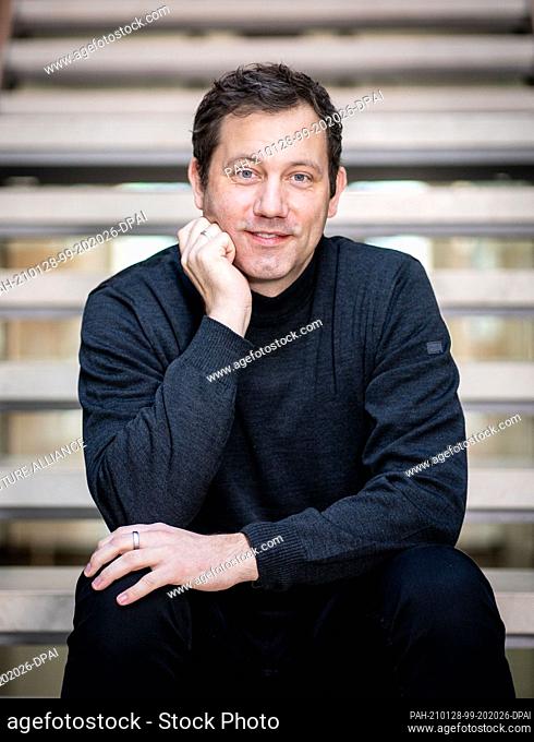 27 January 2021, Berlin: Lars Klingbeil, SPD Secretary General, looks into the photographer's camera at the SPD party headquarters, Willy Brandt House
