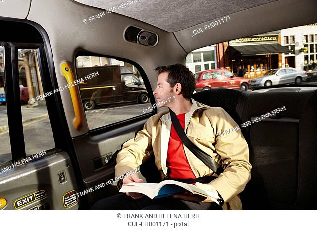 Man looking out of taxi window