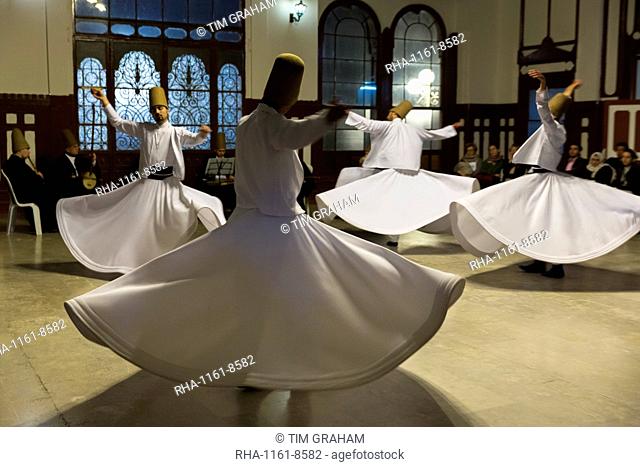 Tourists at Whirling Dervish ayin music performance (Mevlevi Sema) a spiritual ceremony performed by whirling dervishes, Istanbul, Turkey, Eurasia